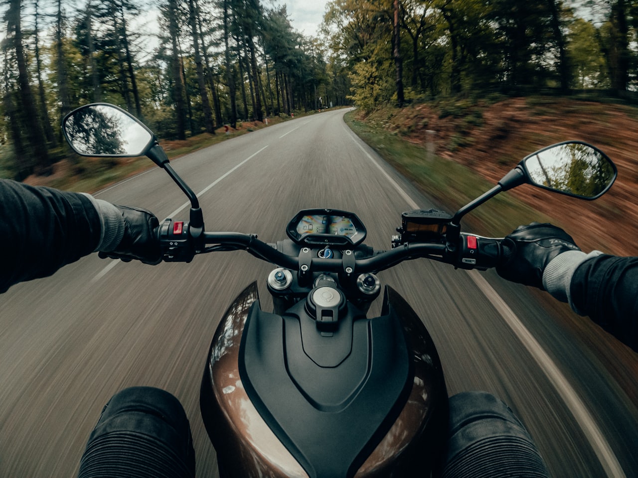Sleek concept electric motorcycle under studio lighting with minimal bodywork